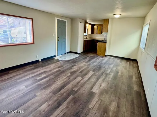a view of an empty room and window