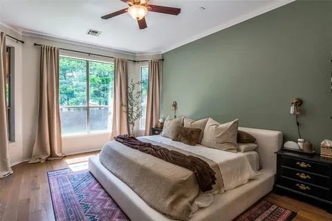 a bedroom with a large bed and a window