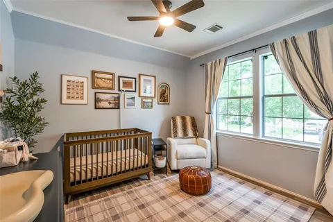 a bedroom with furniture and a window