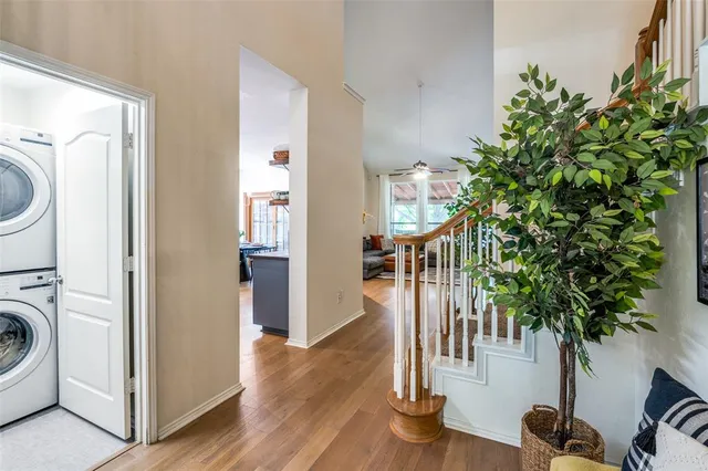 a view of entryway and hall with wooden floor