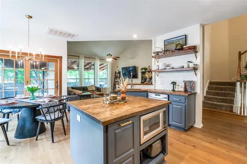 a kitchen with a stove and a refrigerator
