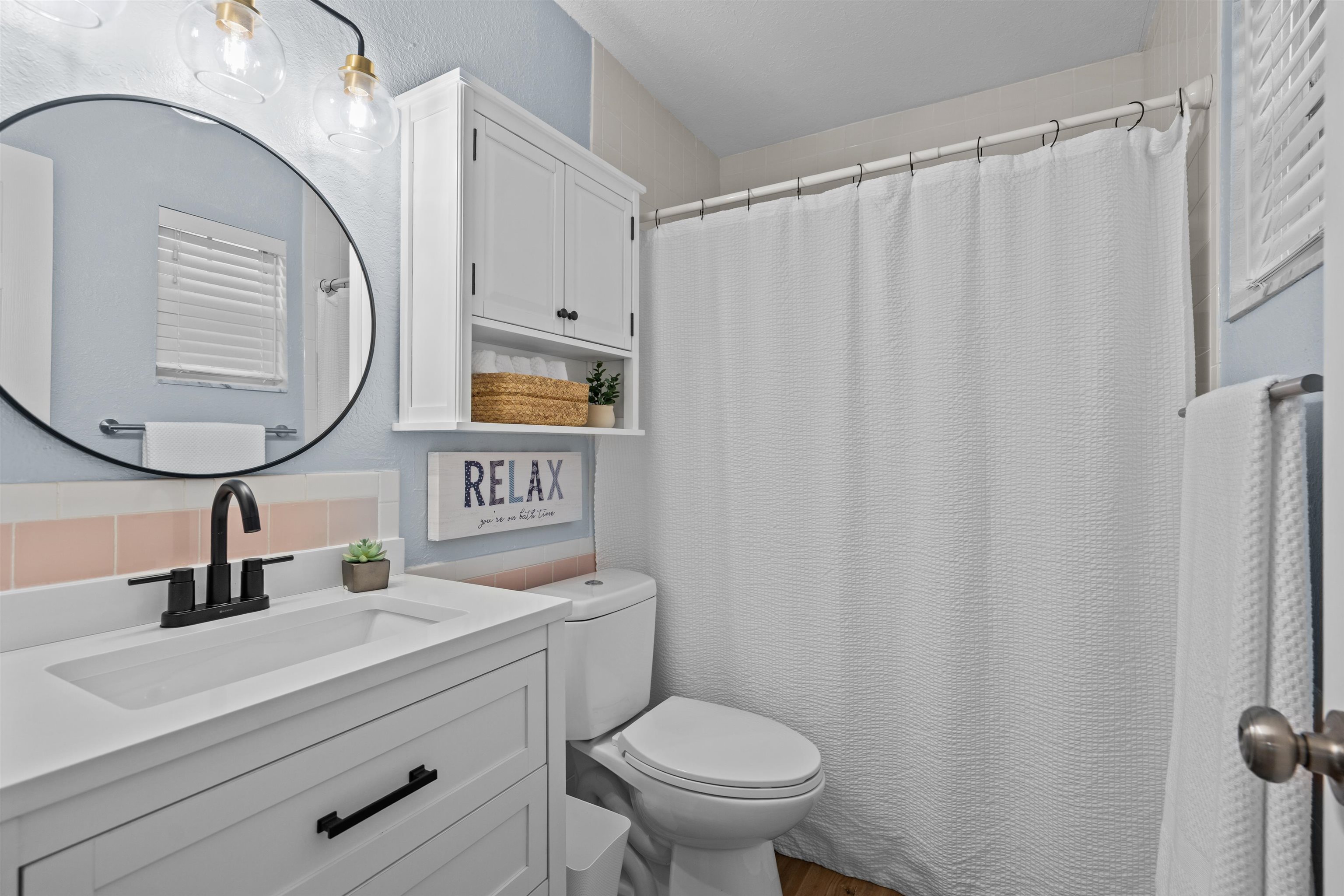285 Trillo Street St. Augustine, FL 32086 - Photo 13 of 48 Full bathroom featuring vanity, a shower with curtain, and dark wood-style floors