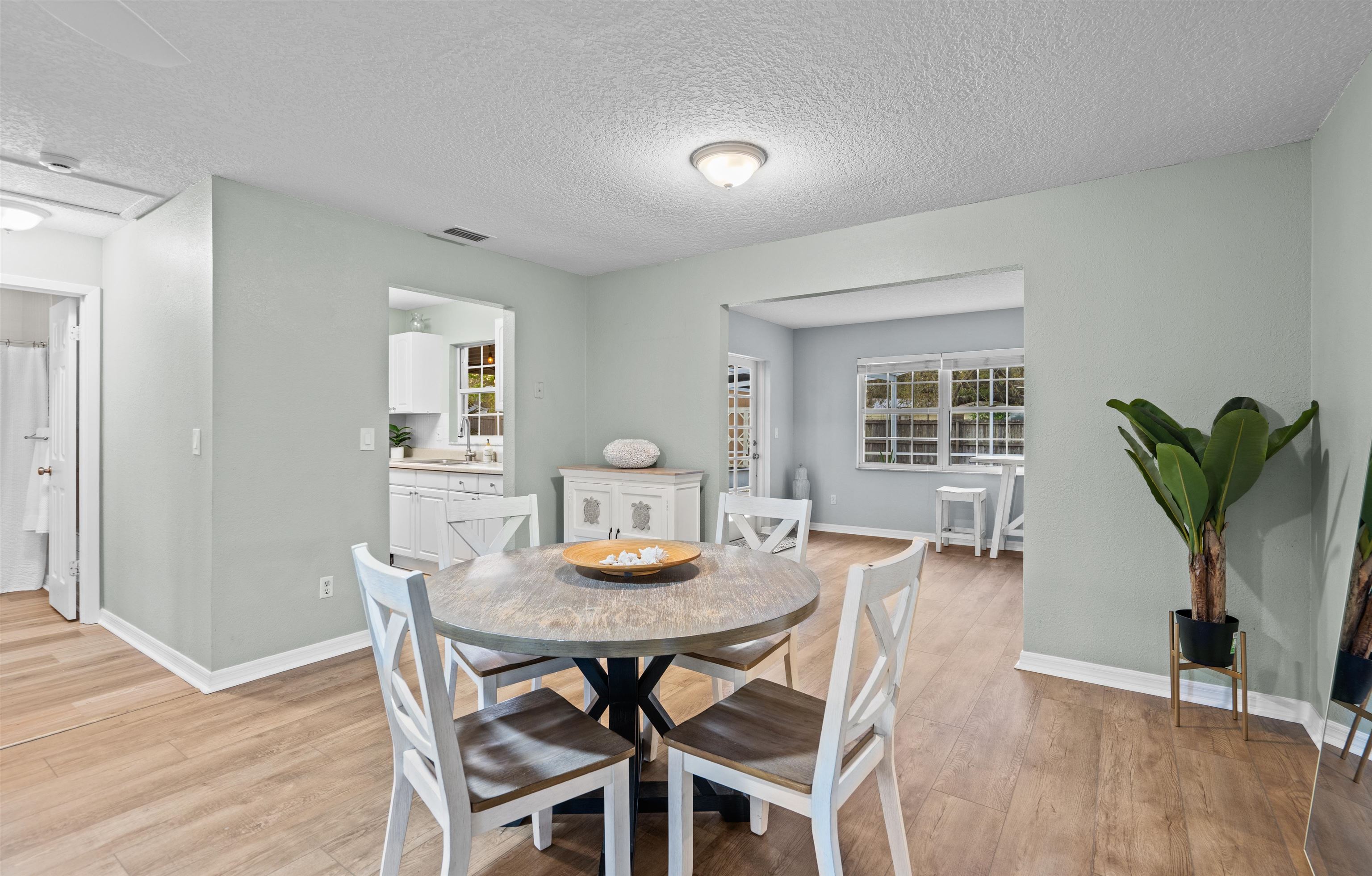 285 Trillo Street St. Augustine, FL 32086 - Photo 16 of 48 Dining space with a textured ceiling and light wood-style floors