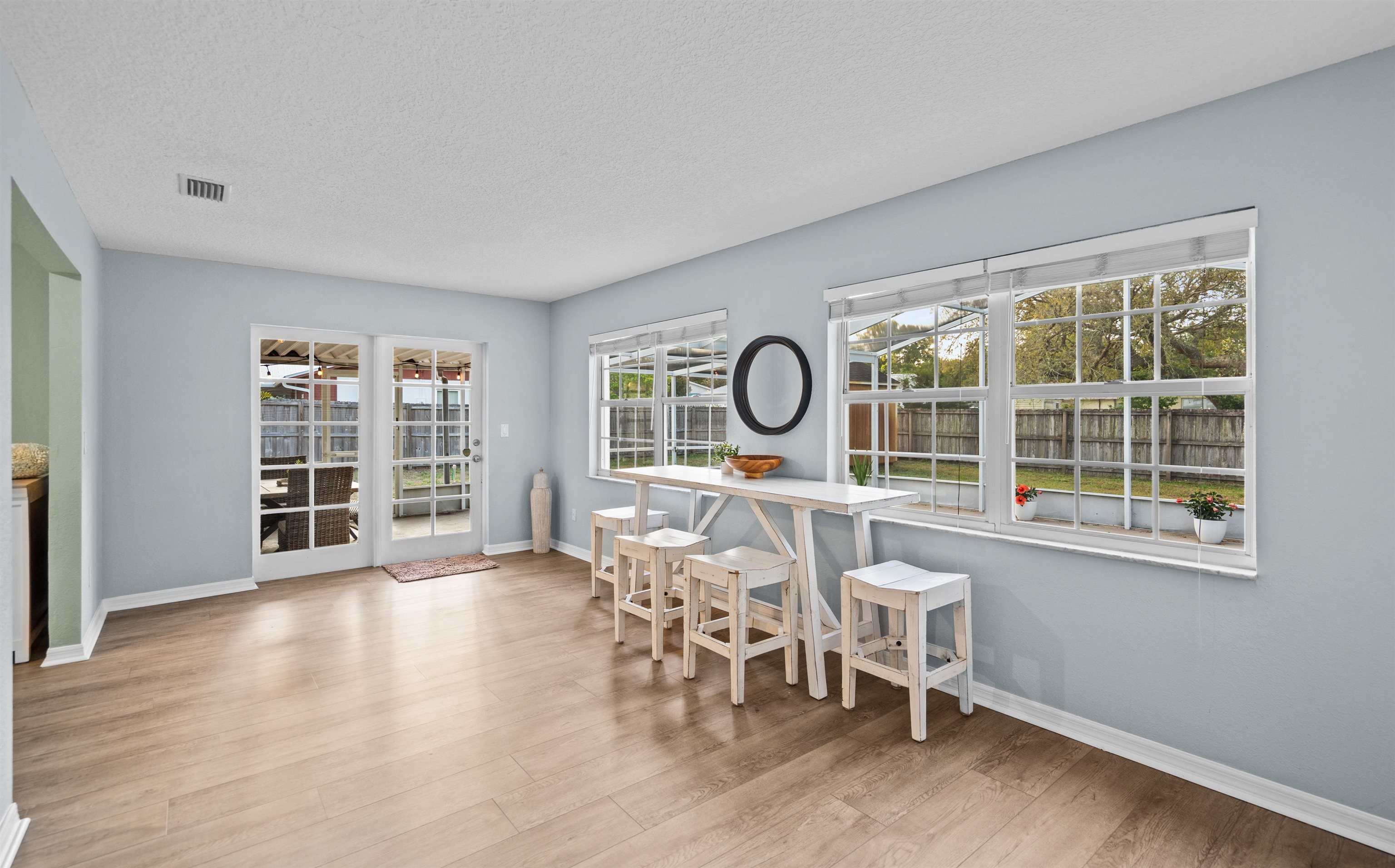285 Trillo Street St. Augustine, FL 32086 - Photo 20 of 48 Dining area featuring light wood finished floors and a textured ceiling