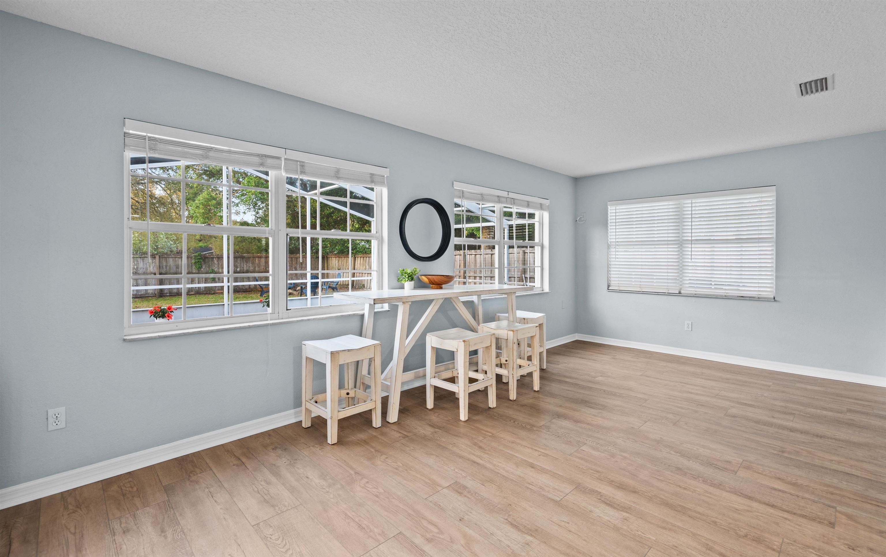 285 Trillo Street St. Augustine, FL 32086 - Photo 21 of 48 Dining space featuring light wood-type flooring and a textured ceiling