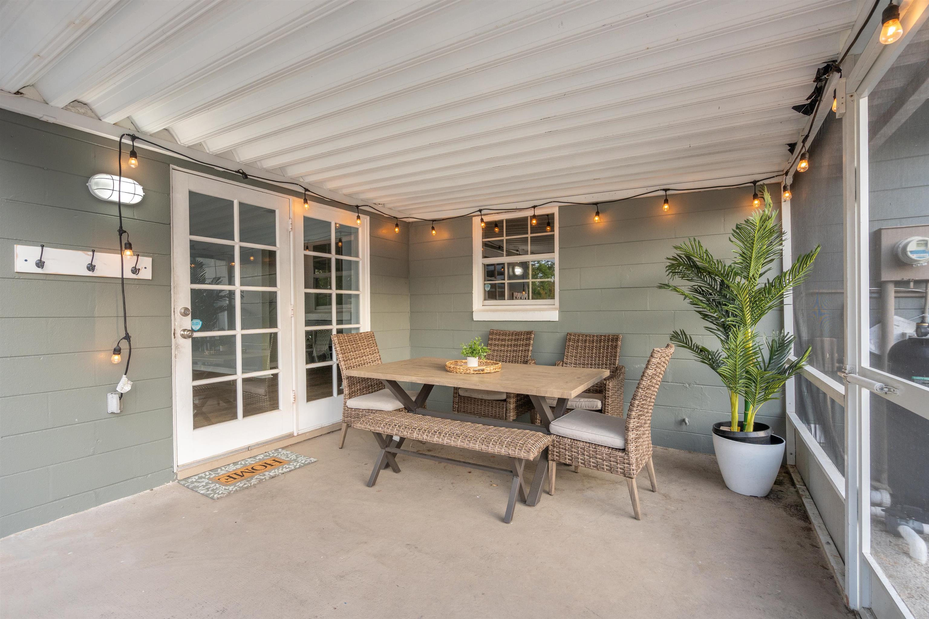285 Trillo Street St. Augustine, FL 32086 - Photo 27 of 48 Sunroom with outdoor dining space and a patio area