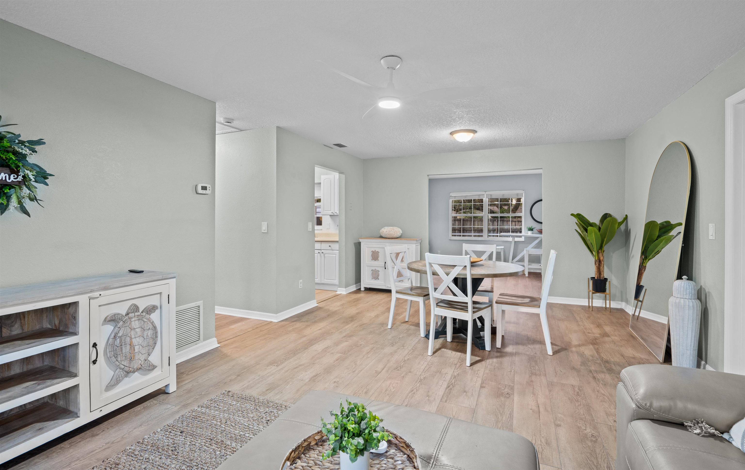 285 Trillo Street St. Augustine, FL 32086 - Photo 5 of 48 Living area featuring light wood-style floors and arched walkways