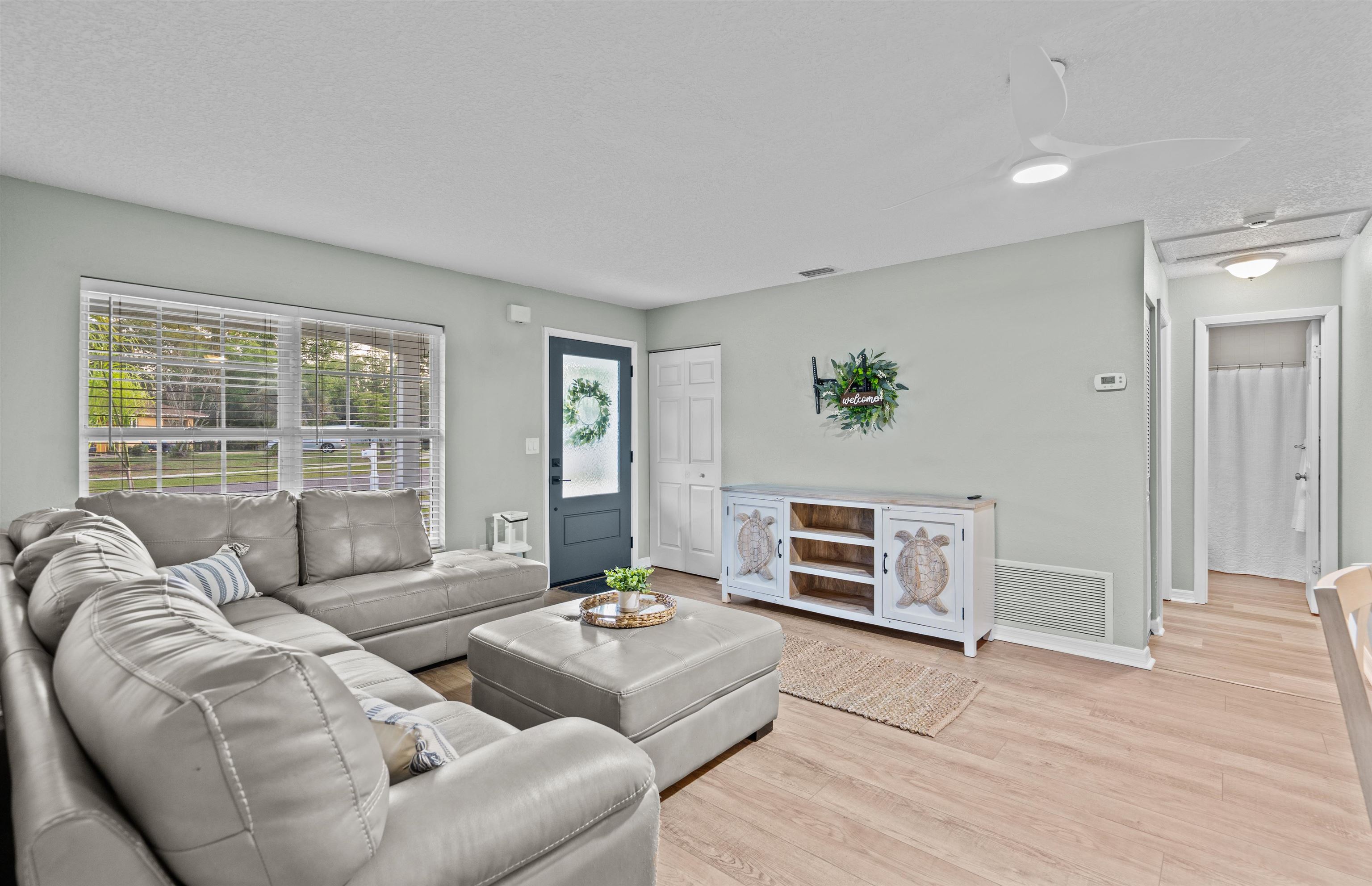 285 Trillo Street St. Augustine, FL 32086 - Photo 6 of 48 Living area featuring light wood finished floors and baseboards