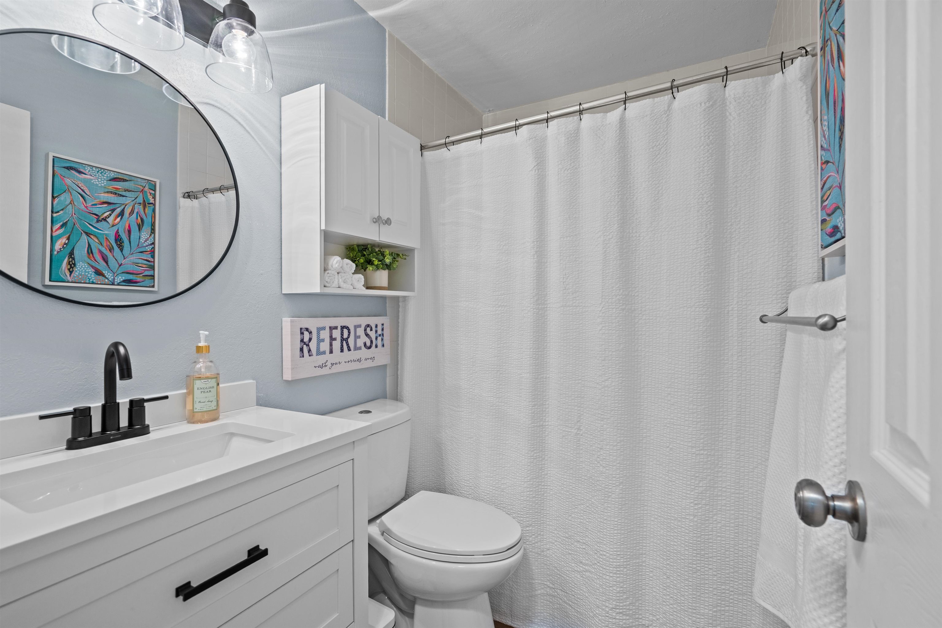 285 Trillo Street St. Augustine, FL 32086 - Photo 10 of 48 Bathroom with vanity and a shower with shower curtain