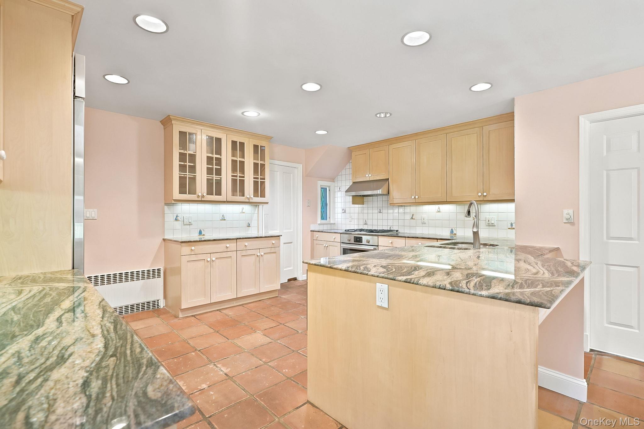 1 Sheridan Road Scarsdale, NY 10583 - Photo 13 of 40 Additional view of Kitchen highlighting generous cabinetry including uppers with glass vitrines