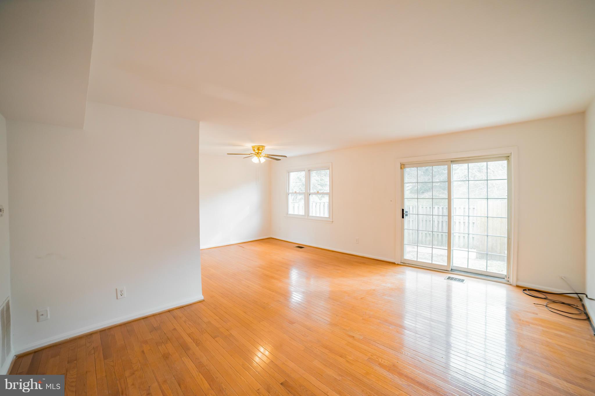 38 Oak Shade Road Gaithersburg, MD 20878 - Photo 4 of 22 Living Room From Hallway/Looking Towards Backyard