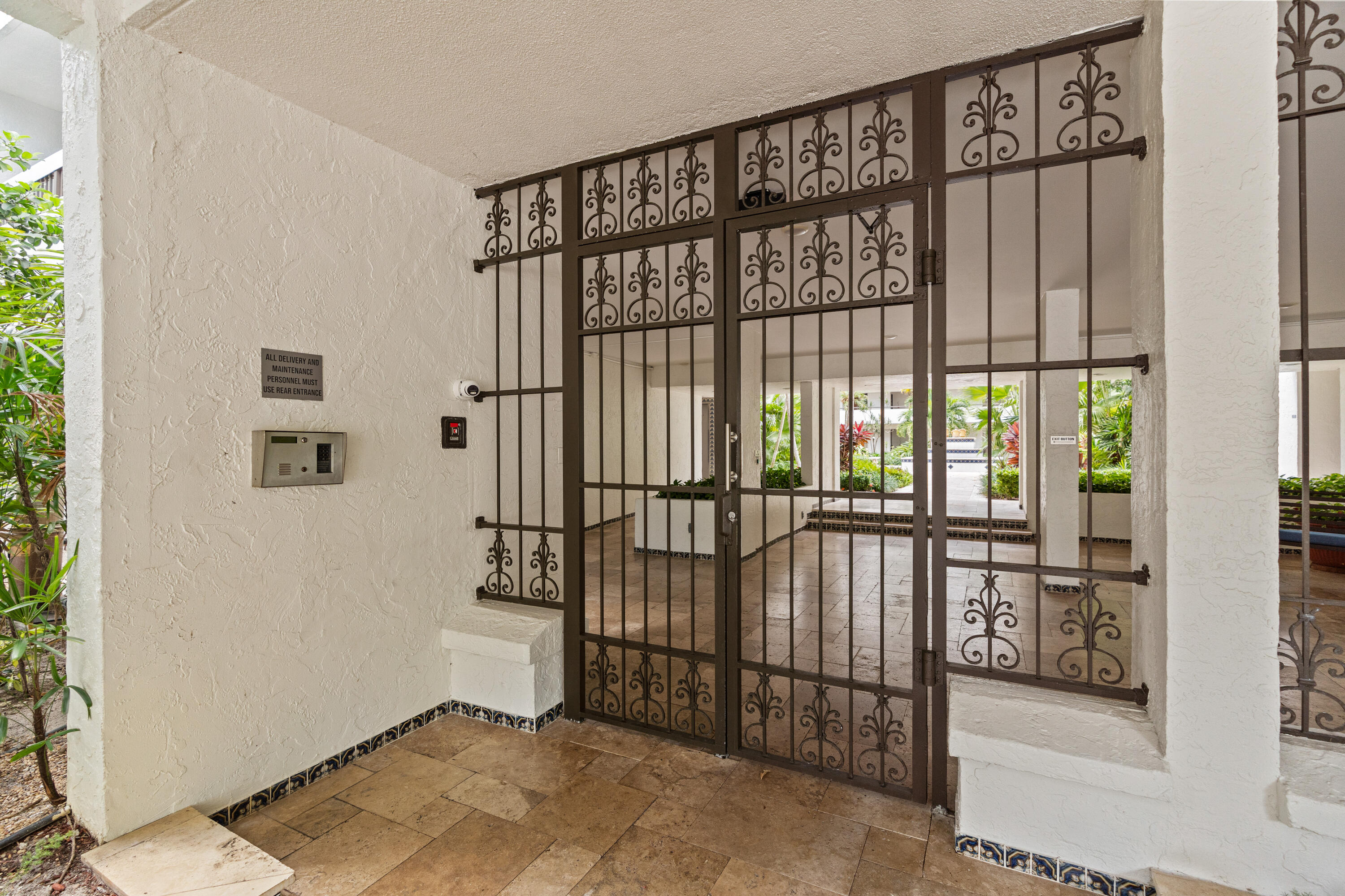 23200 Camino Del Mar, Unit 603 Boca Raton, FL 33433 - Photo 33 of 43 a view of an entryway with a floor to ceiling window