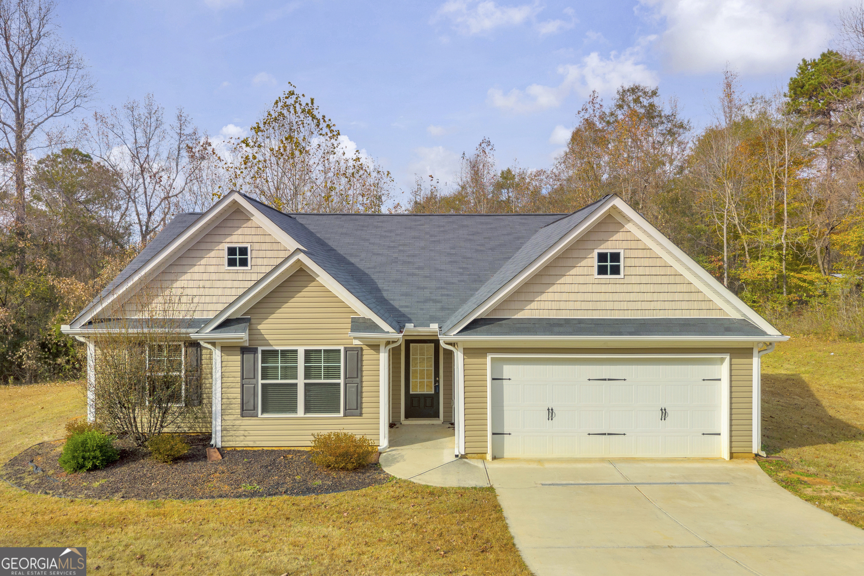 1065 Hebron Road Commerce, GA 30530 - Photo 1 of 1 a front view of a house with a yard and garage