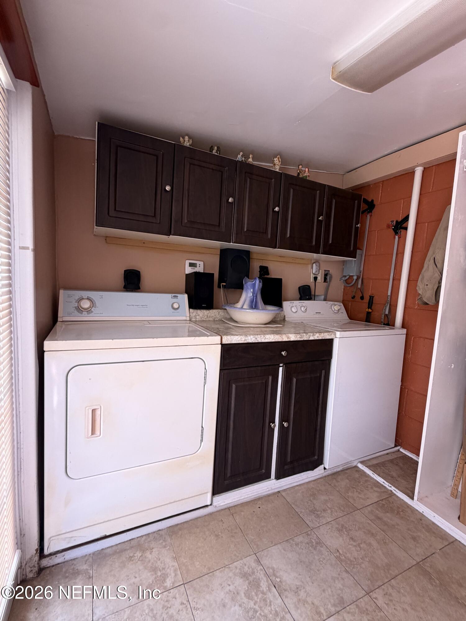 4127 Springwood Road Jacksonville, FL 32207 - Photo 61 of 63 a utility room with dryer and washer
