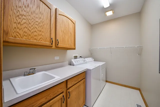 a view of a sink and cabinets