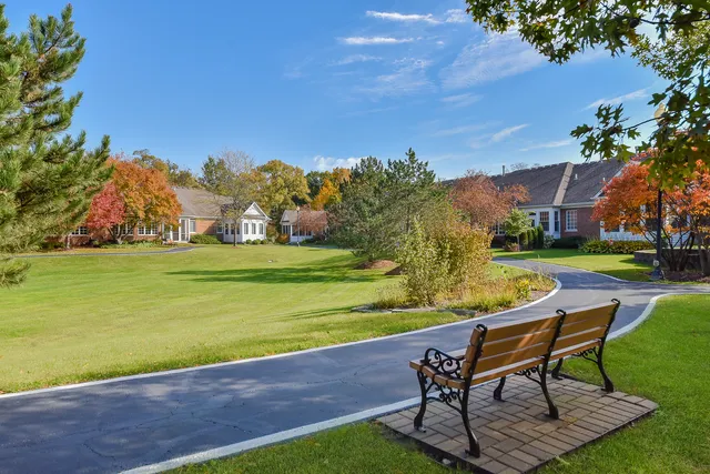 a view of a table and chairs in the garden