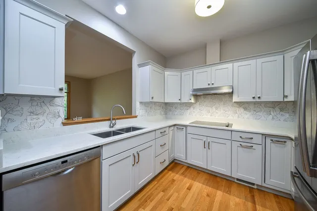 a kitchen with a sink and cabinets