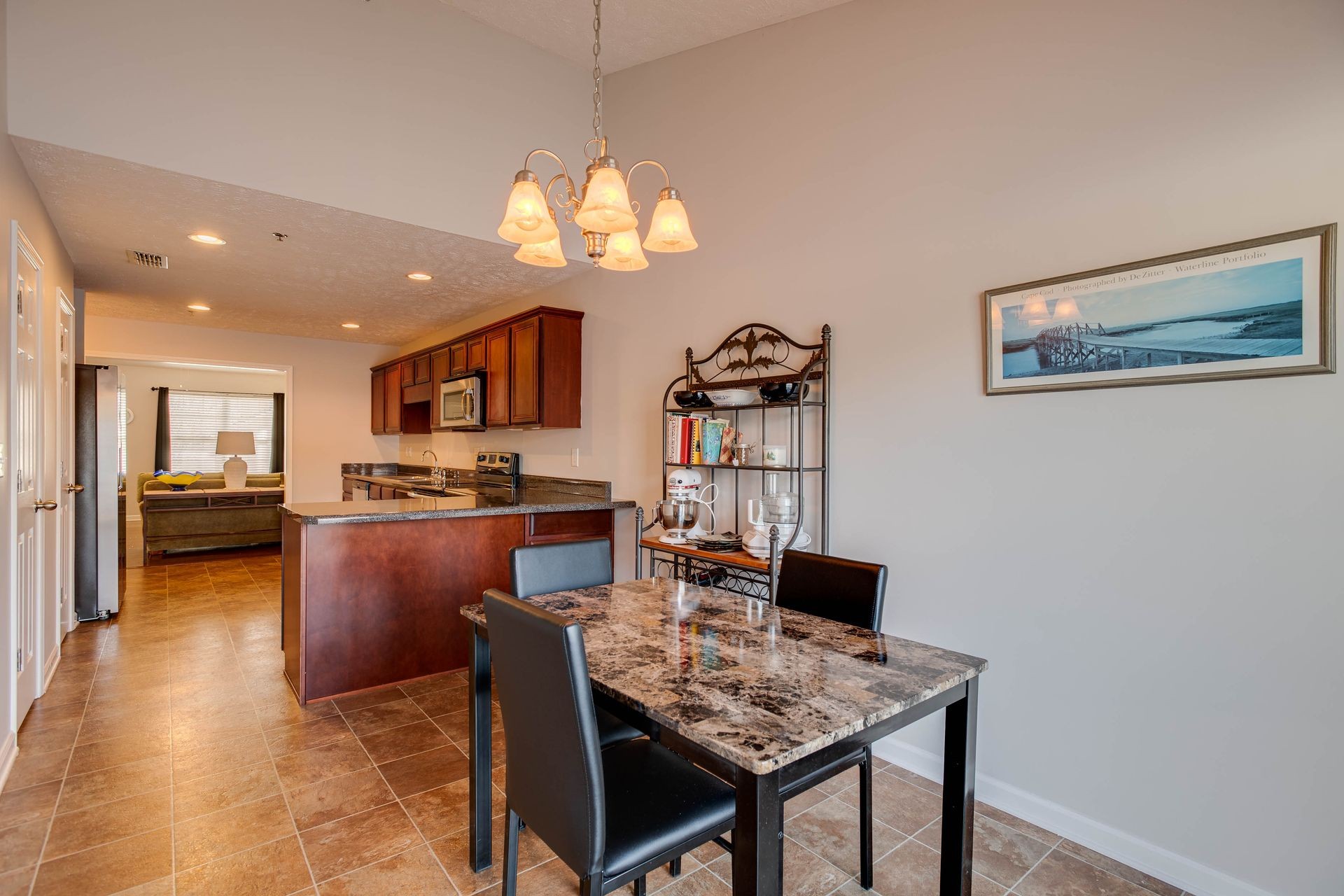3057 Soaring Eagle Way Spring Hill, TN 37174 - Photo 11 of 32 a view of a dining room with furniture and a chandelier