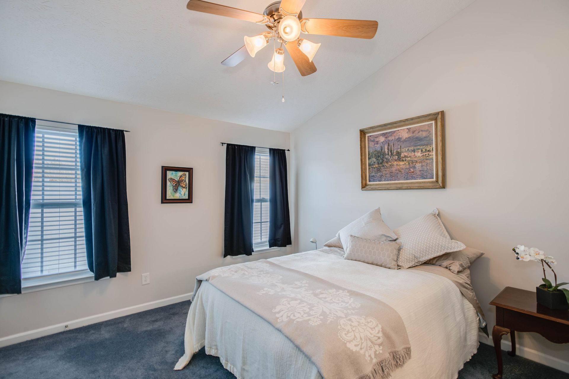 3057 Soaring Eagle Way Spring Hill, TN 37174 - Photo 14 of 32 a bedroom with a large bed and a chandelier