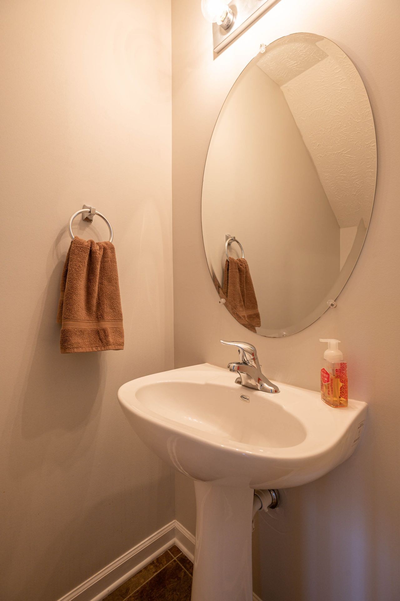 3057 Soaring Eagle Way Spring Hill, TN 37174 - Photo 17 of 32 a bathroom with a sink and mirror
