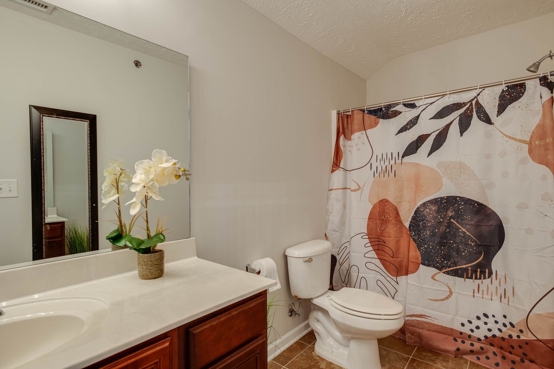 3057 Soaring Eagle Way Spring Hill, TN 37174 - Photo 22 of 32 a bathroom with a sink a toilet and a mirror