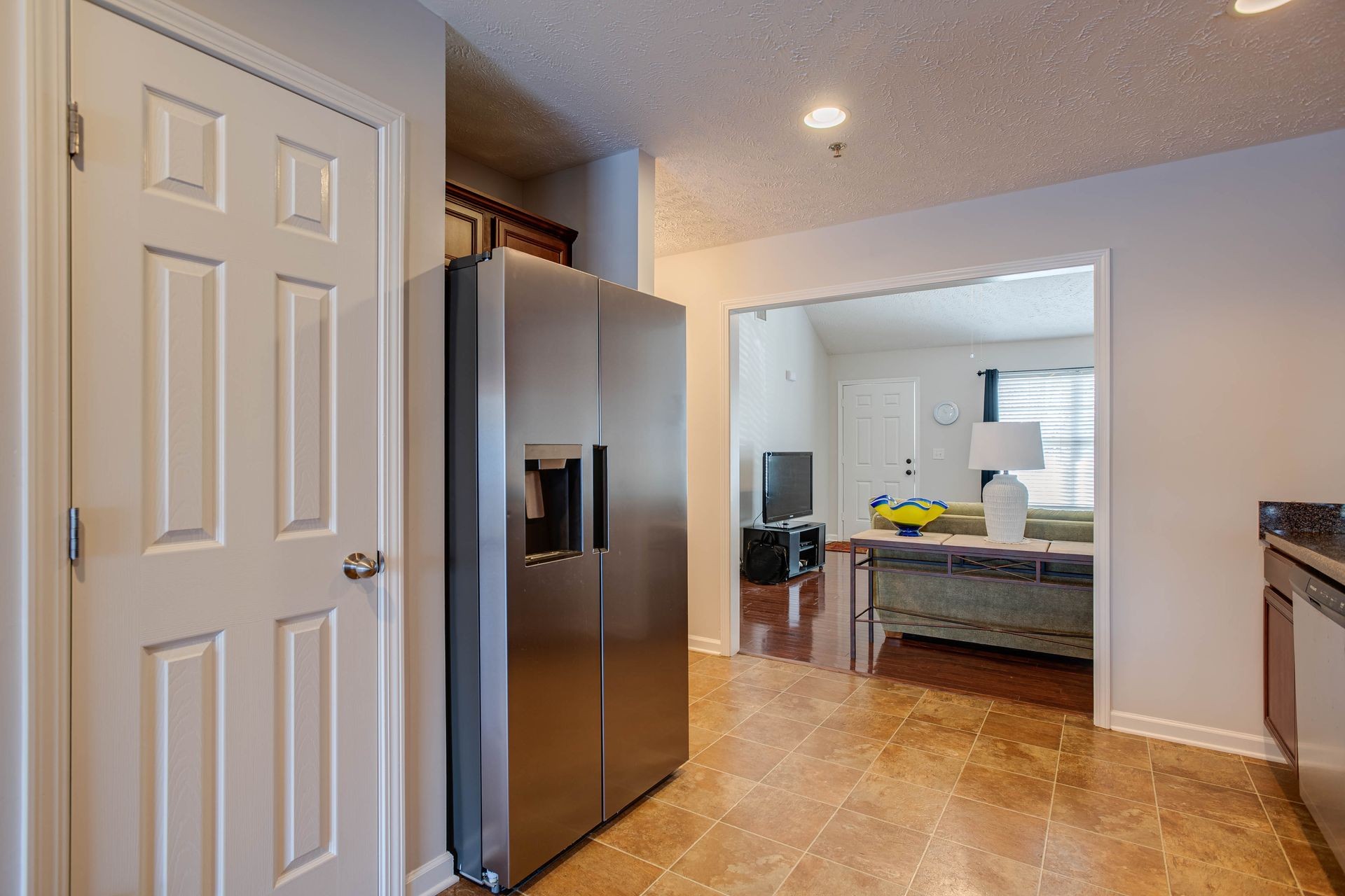 3057 Soaring Eagle Way Spring Hill, TN 37174 - Photo 8 of 32 a kitchen with kitchen island a counter top space a sink stainless steel appliances and cabinets