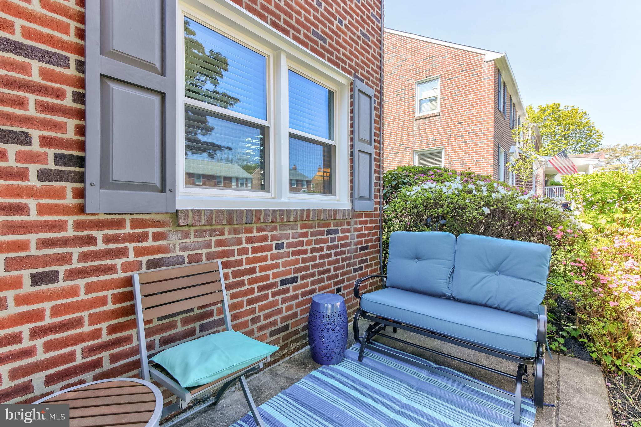 148 Signal Road Drexel Hill, PA 19026 - Photo 3 of 37 a blue bench sitting in front of a building