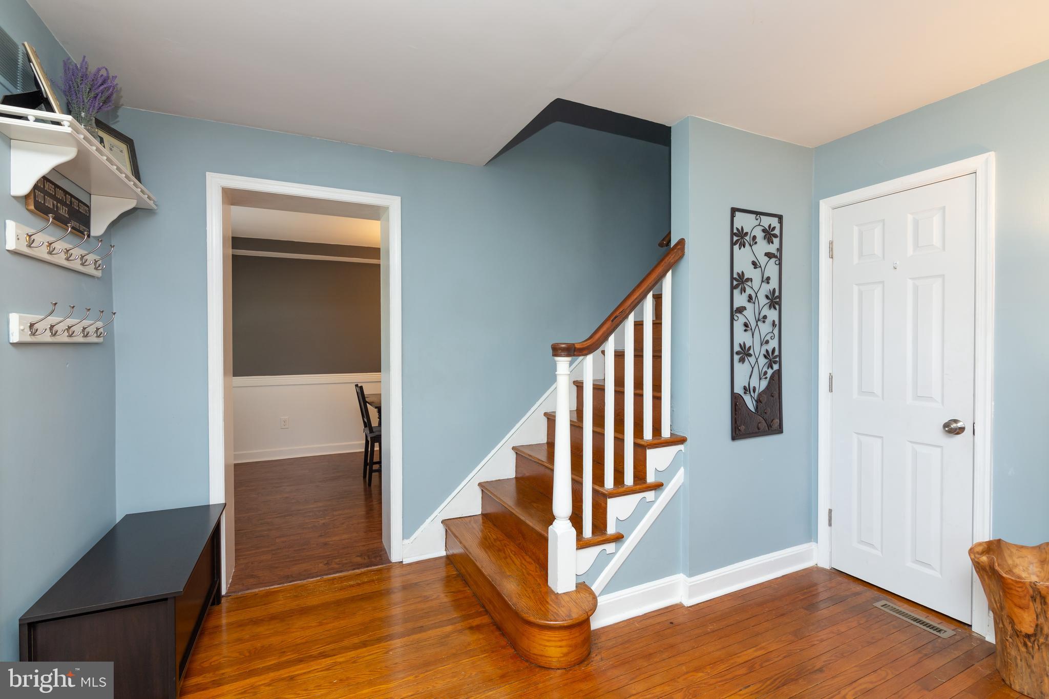 148 Signal Road Drexel Hill, PA 19026 - Photo 5 of 37 a view of a hallway with wooden floor and staircase