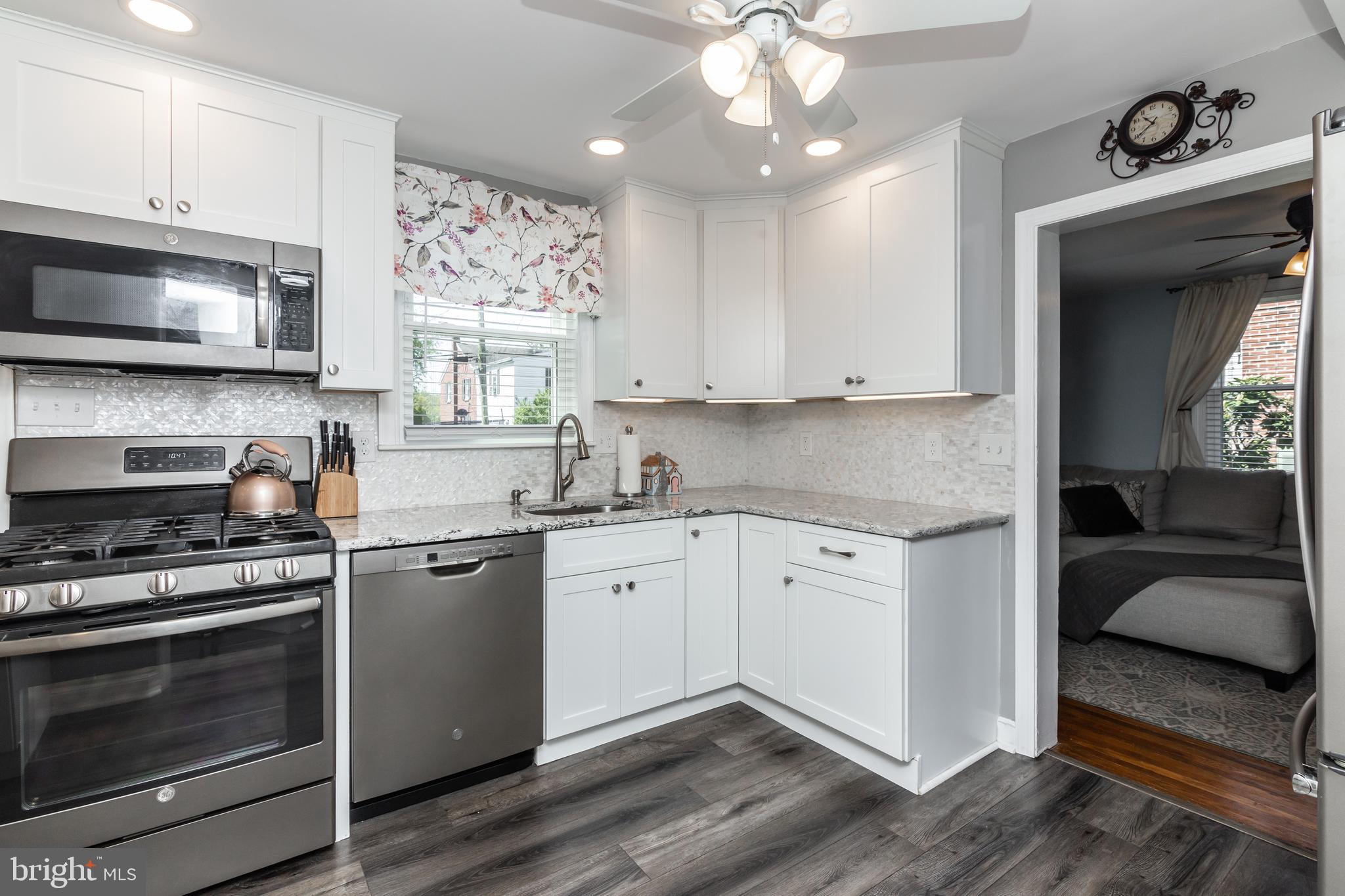 148 Signal Road Drexel Hill, PA 19026 - Photo 6 of 37 a kitchen with stainless steel appliances granite countertop a stove and a sink