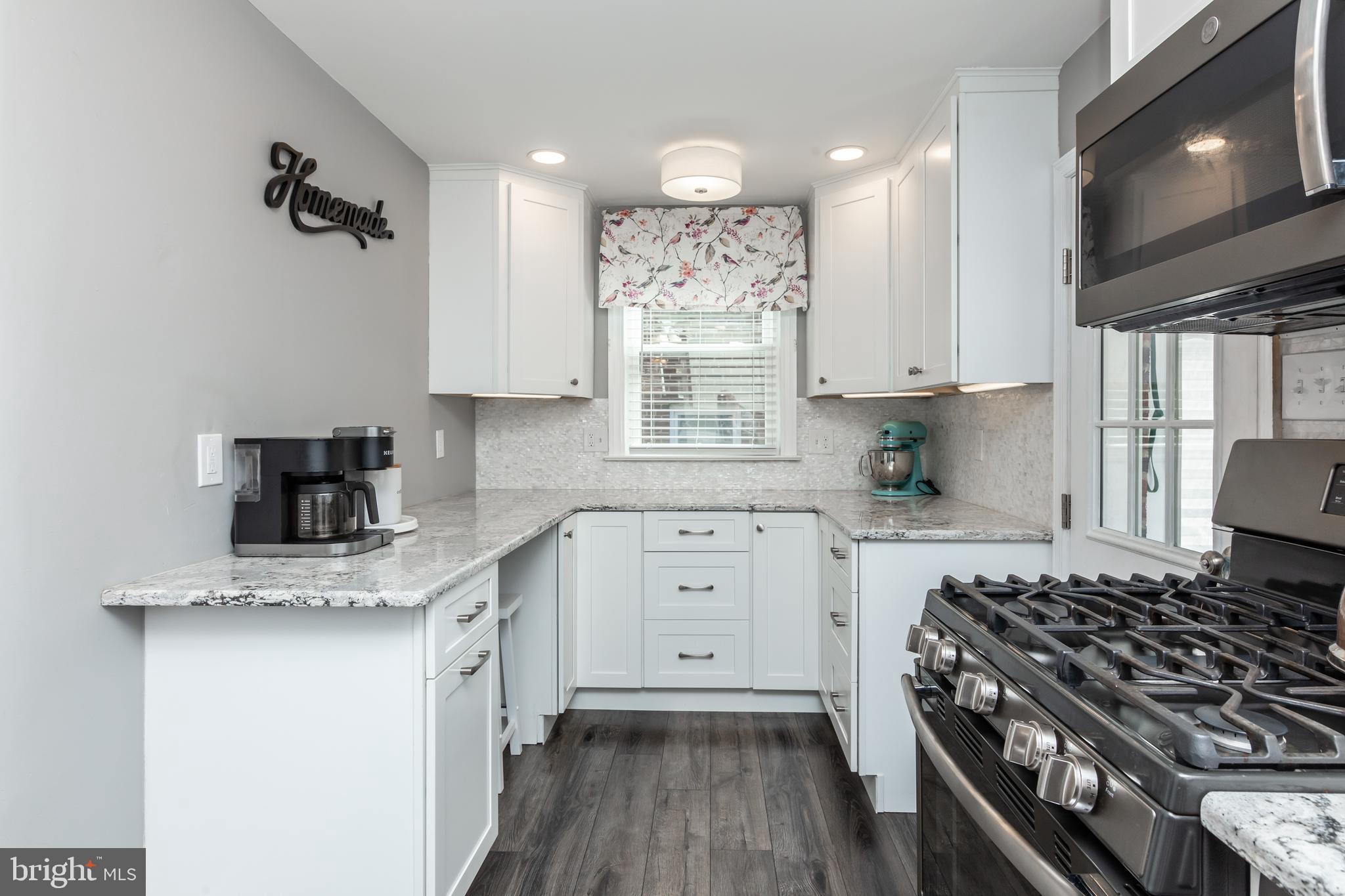 148 Signal Road Drexel Hill, PA 19026 - Photo 8 of 37 a kitchen with a stove a sink and a microwave
