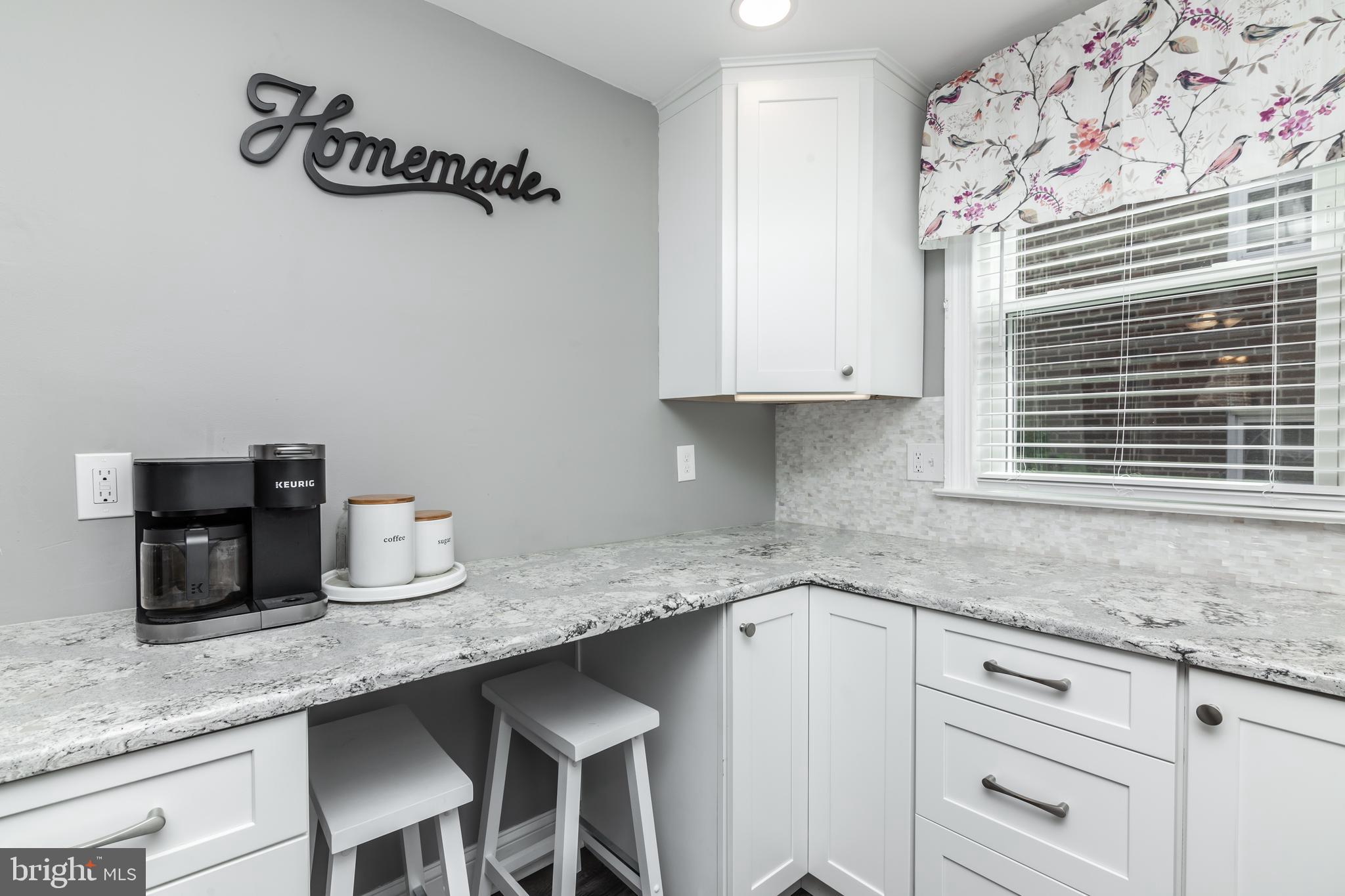 148 Signal Road Drexel Hill, PA 19026 - Photo 10 of 37 a kitchen with granite countertop a sink a window and cabinets