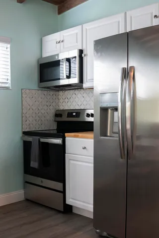 a kitchen with stainless steel appliances a stove and a refrigerator