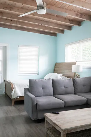 a living room with furniture and a window