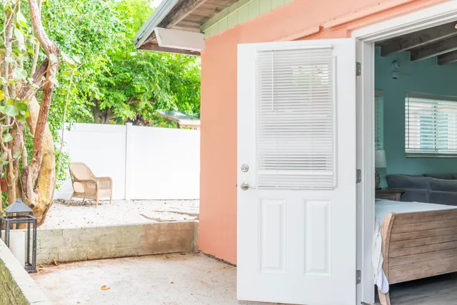 a front view of a house with chairs
