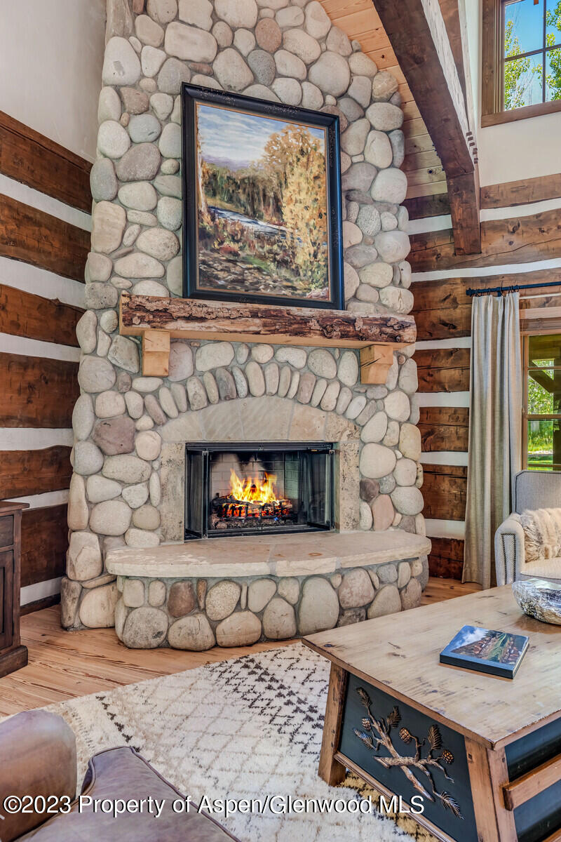 6 A Arbaney Ranch Road Basalt, CO 81621 - Photo 12 of 44 a living room with a couch and a fireplace