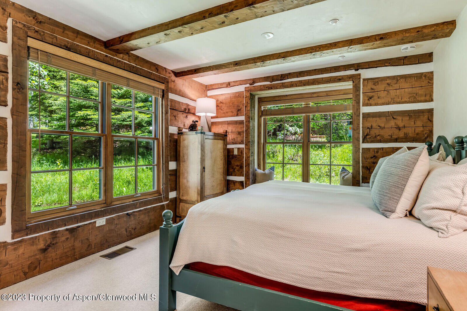 6 A Arbaney Ranch Road Basalt, CO 81621 - Photo 29 of 44 a bed sitting in a bedroom next to a window