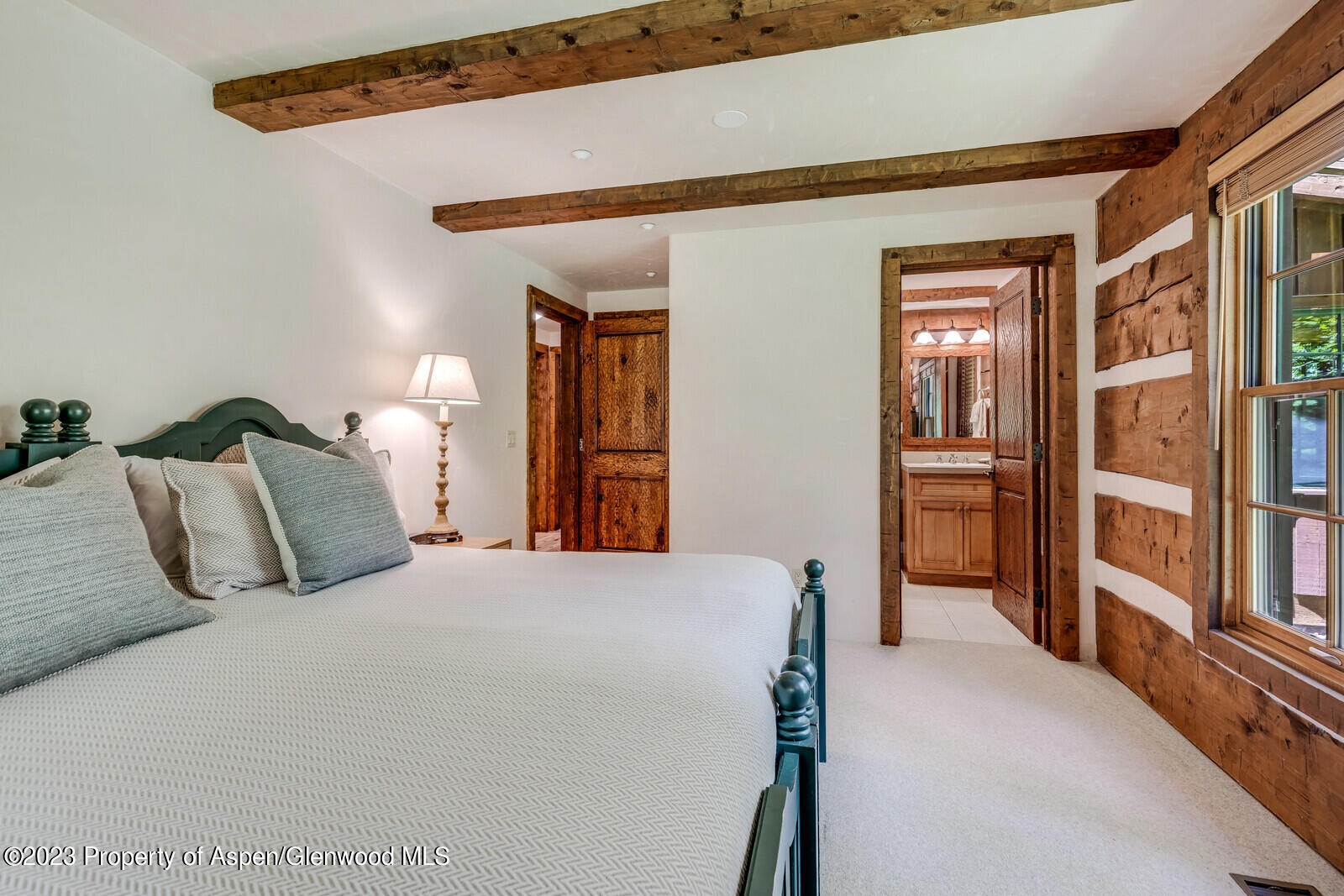 6 A Arbaney Ranch Road Basalt, CO 81621 - Photo 30 of 44 a bedroom with a large bed and walk in closet