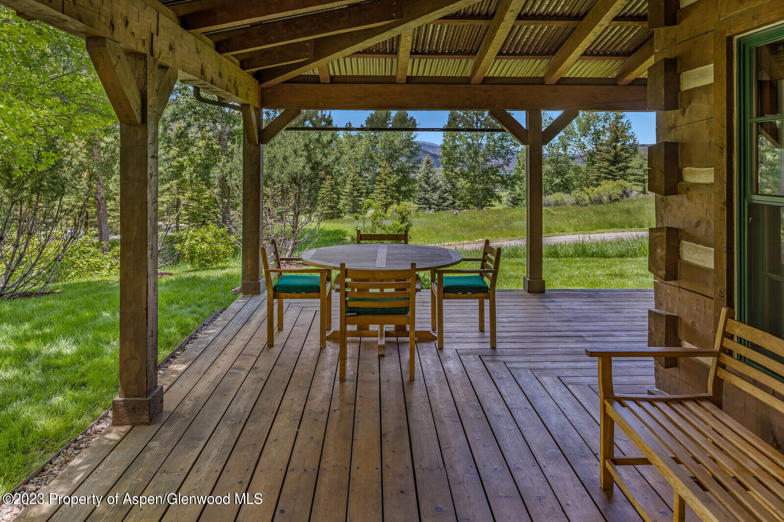 6 A Arbaney Ranch Road Basalt, CO 81621 - Photo 34 of 44 a view of a porch with furniture and wooden floor