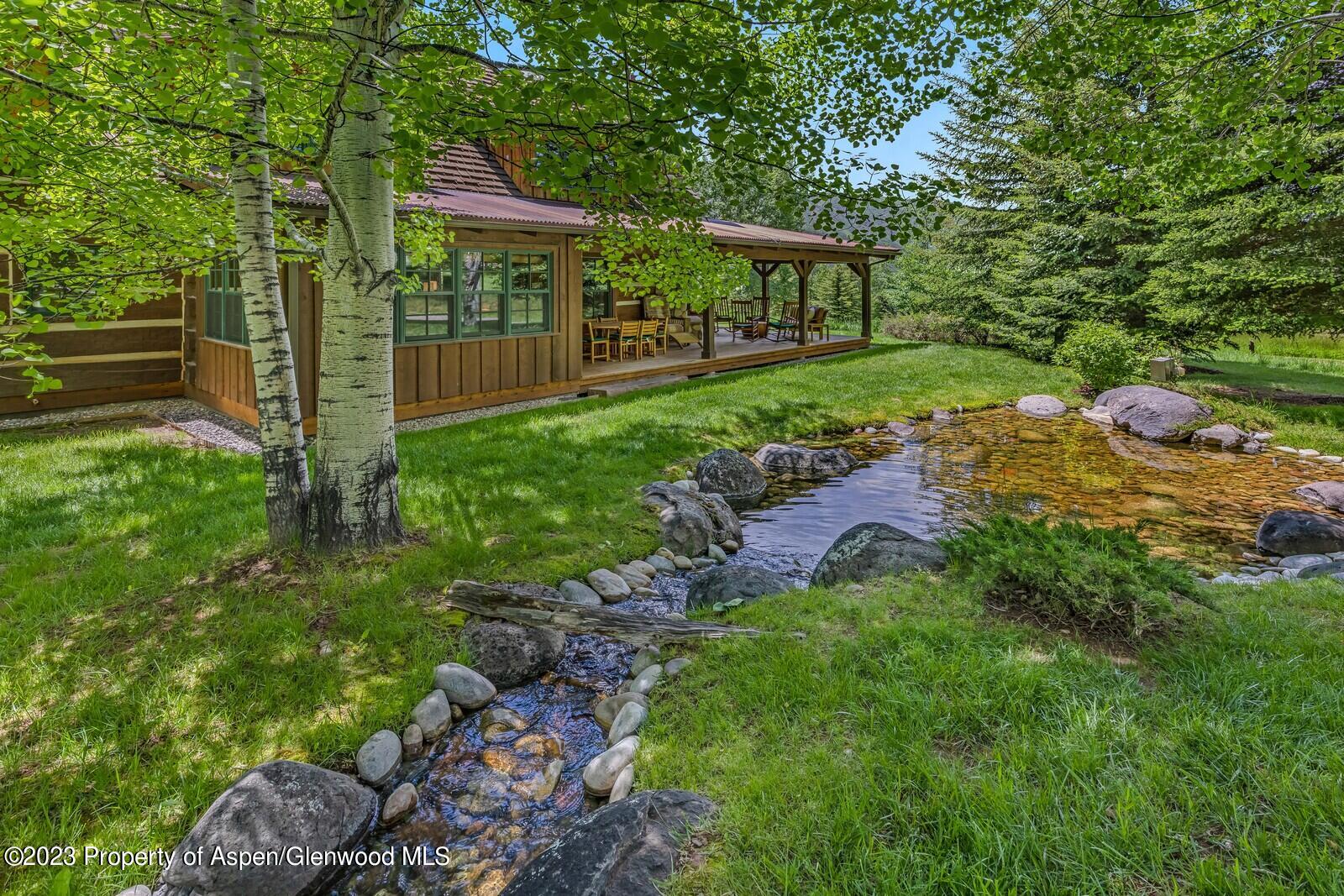 6 A Arbaney Ranch Road Basalt, CO 81621 - Photo 5 of 44 a view of a porch with a yard