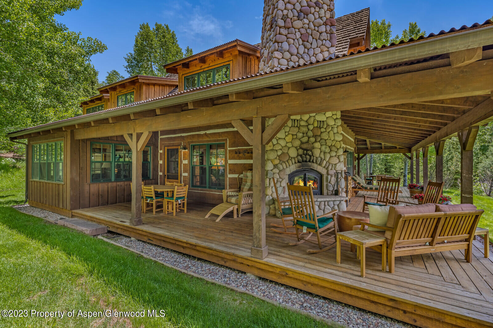 6 A Arbaney Ranch Road Basalt, CO 81621 - Photo 6 of 44 a view of a patio with table and chairs near a barbeque