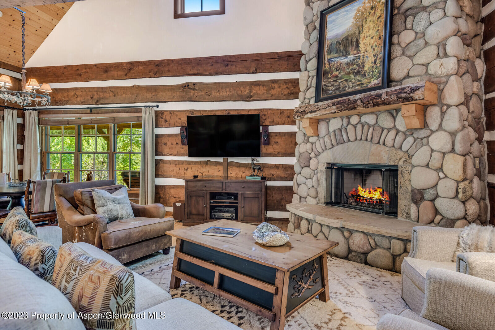 6 A Arbaney Ranch Road Basalt, CO 81621 - Photo 8 of 44 a living room with furniture a fireplace and a flat screen tv