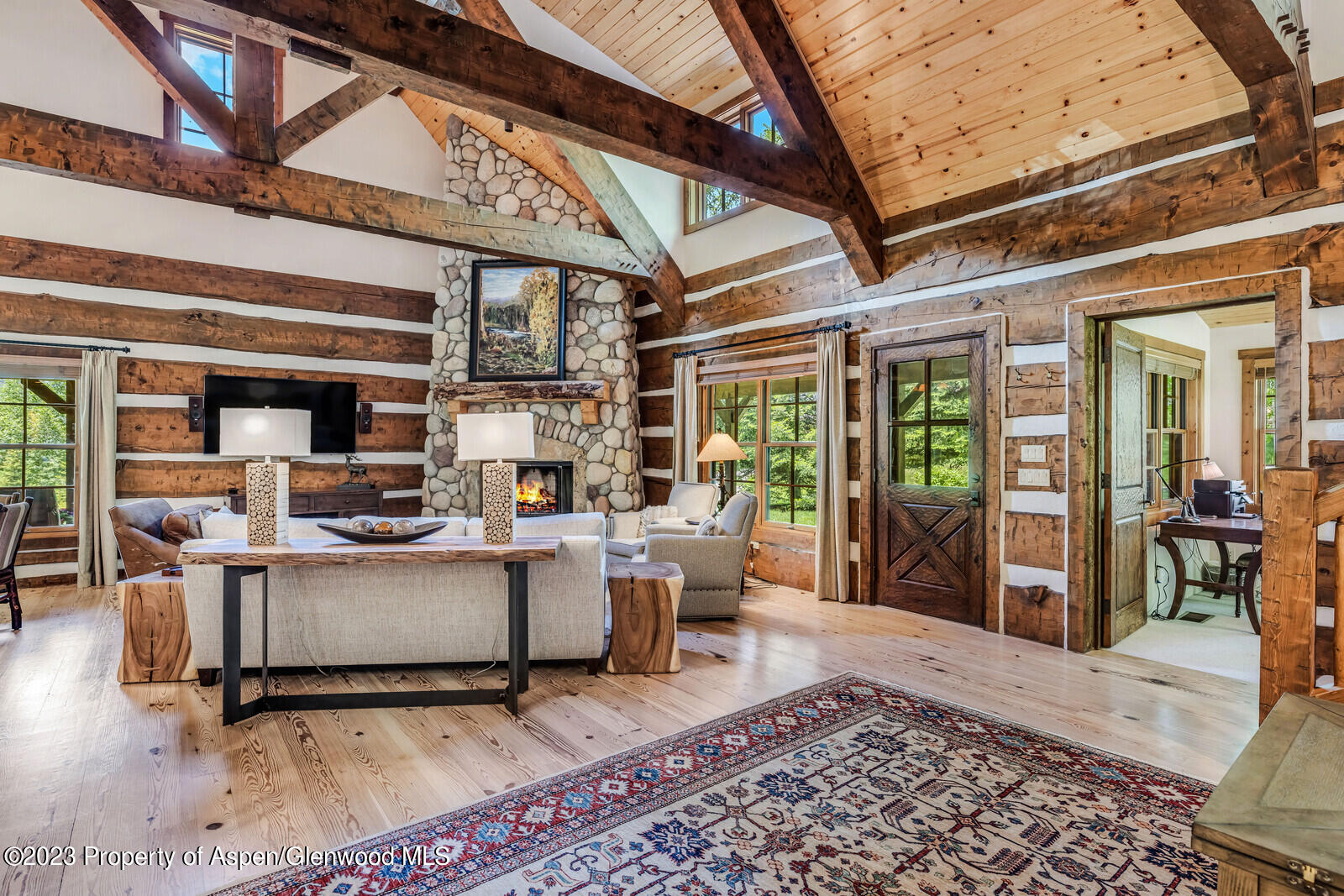 6 A Arbaney Ranch Road Basalt, CO 81621 - Photo 9 of 44 a living room with furniture a wooden floor and next to a window