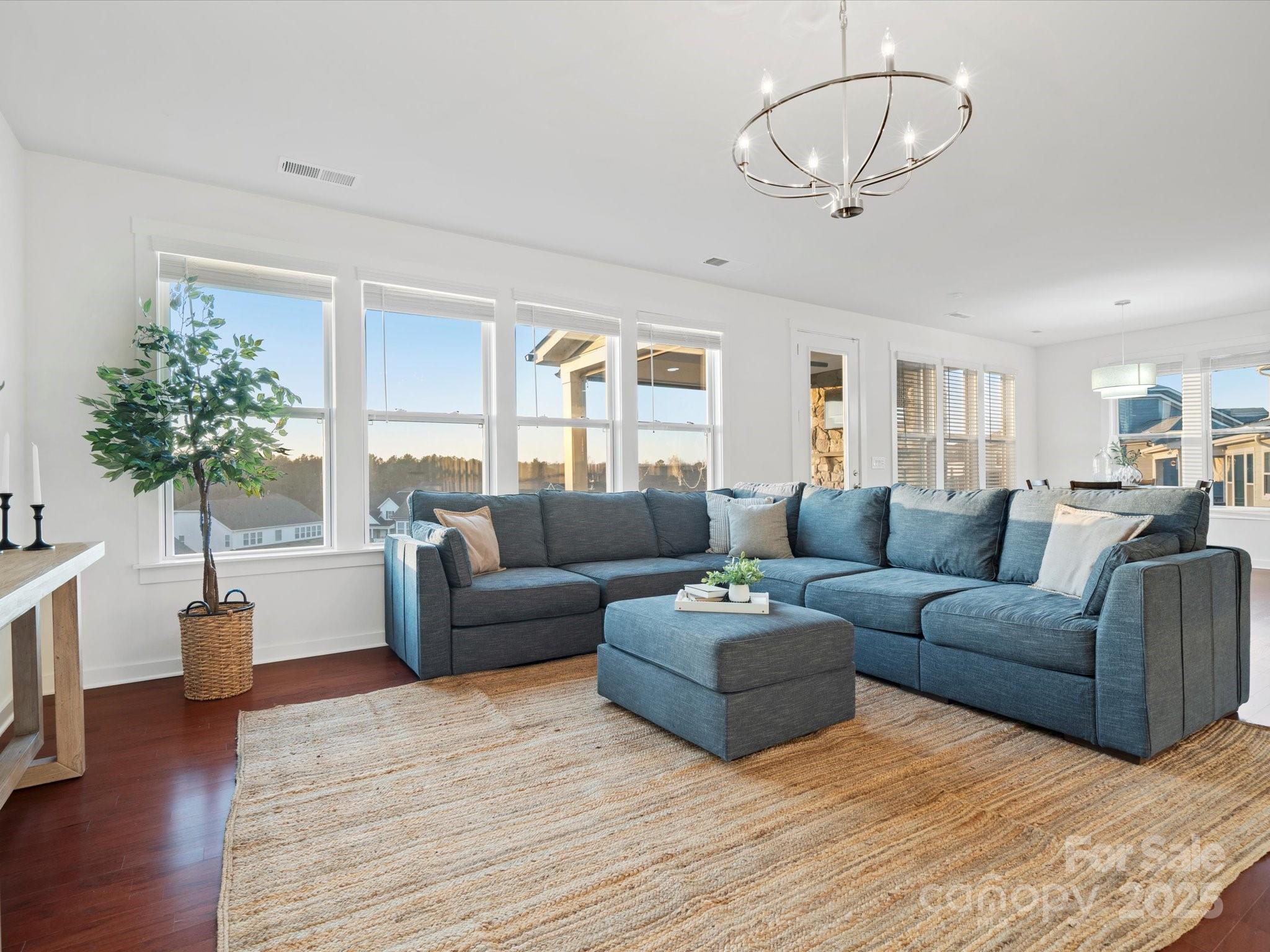 523 Rock Skip Way Fort Mill, SC 29708 - Photo 16 of 48 a living room with furniture or chandelier and a wooden floor