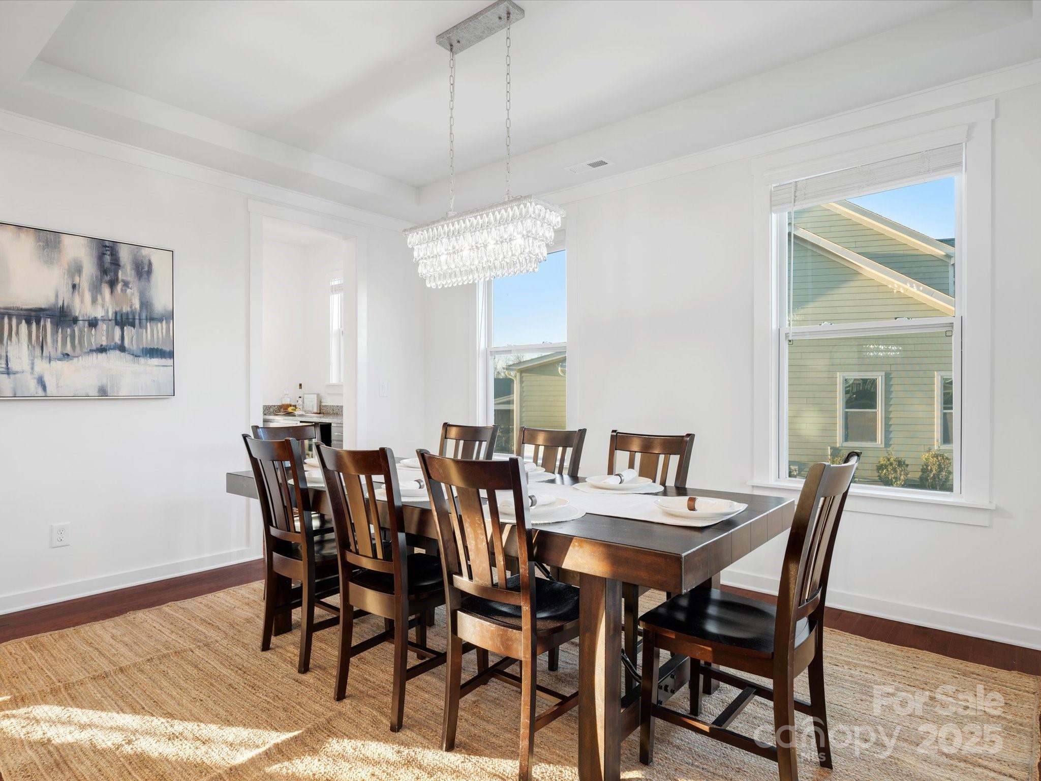 523 Rock Skip Way Fort Mill, SC 29708 - Photo 4 of 48 a view of a dining room with furniture and wooden floor