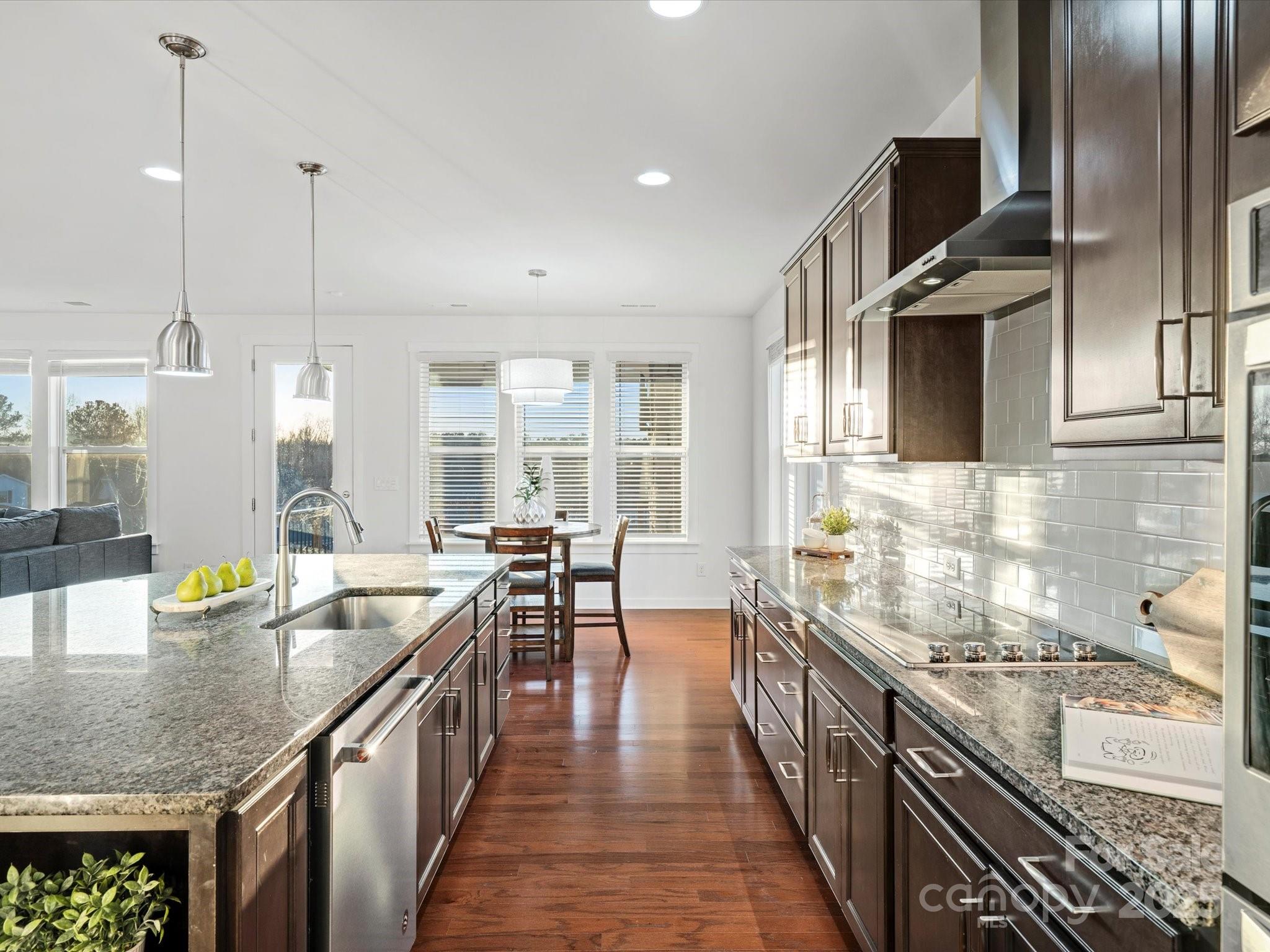 523 Rock Skip Way Fort Mill, SC 29708 - Photo 8 of 48 a kitchen with counter top space and wooden floor