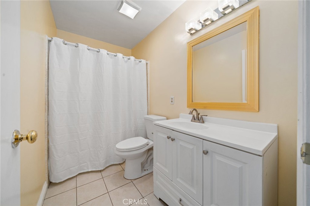 1311 South Grand Avenue, Unit 5 San Pedro, CA 90731 - Photo 12 of 20 a bathroom with a sink toilet and shower