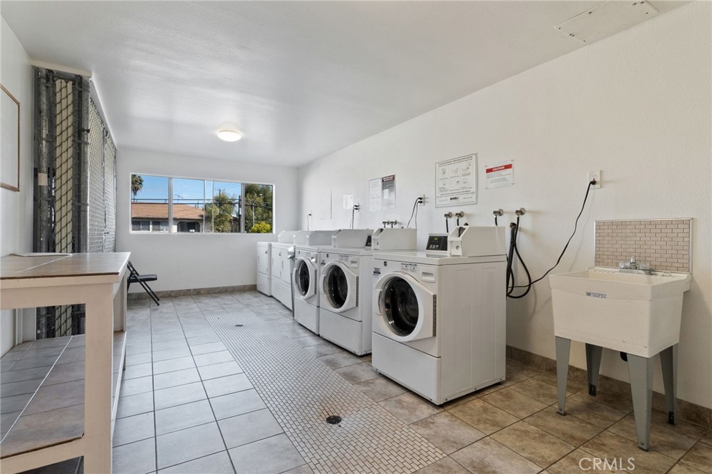 1311 South Grand Avenue, Unit 5 San Pedro, CA 90731 - Photo 20 of 20 a utility room with cabinets dryer and washer