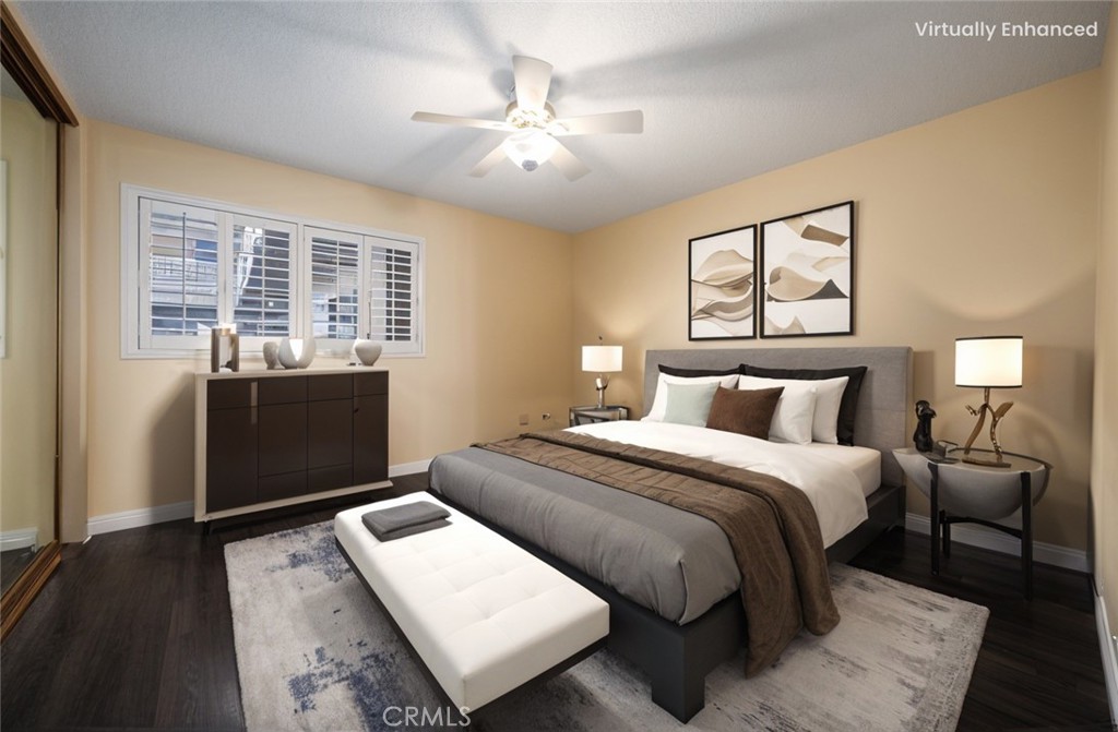 1311 South Grand Avenue, Unit 5 San Pedro, CA 90731 - Photo 3 of 20 a bedroom with a bed and wooden floor