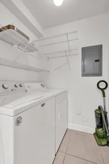 a bathroom with a toilet sink and shower