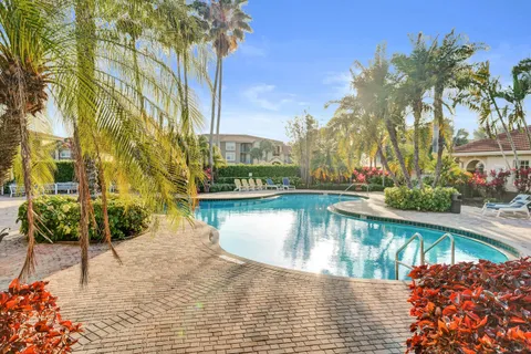a view of a swimming pool with a table and chairs